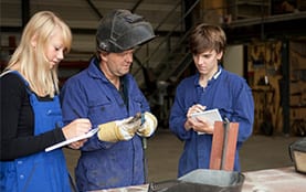 Welder teaching students